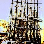 A Tall Ship Tied in Harbor
