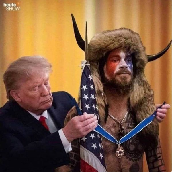 Trump giving horned guy the freedom medal 2021